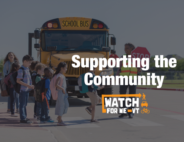 Supporting the Community: group of children entering school bus