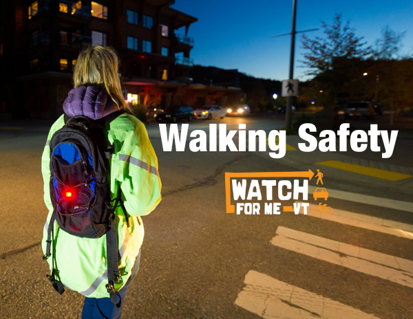 Person walking wearing reflectors. Text reads walking safety.